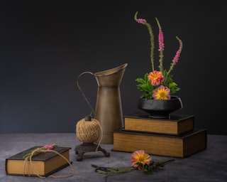 a vase and a couple of flowers