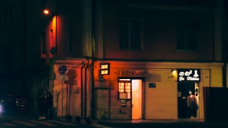 a car is parked outside of a building at night
