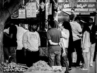 People gathered around a street vendor's stall.